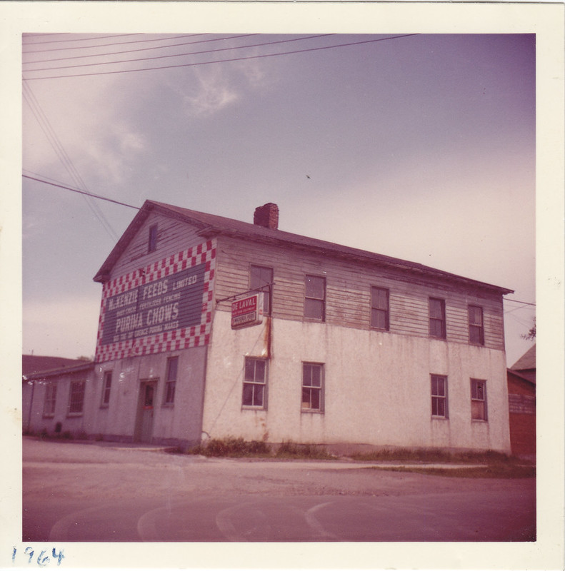 Mackenzie Feeds building with large advertising panel on one wall.