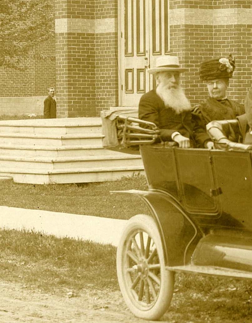 Man standing in background of photo.