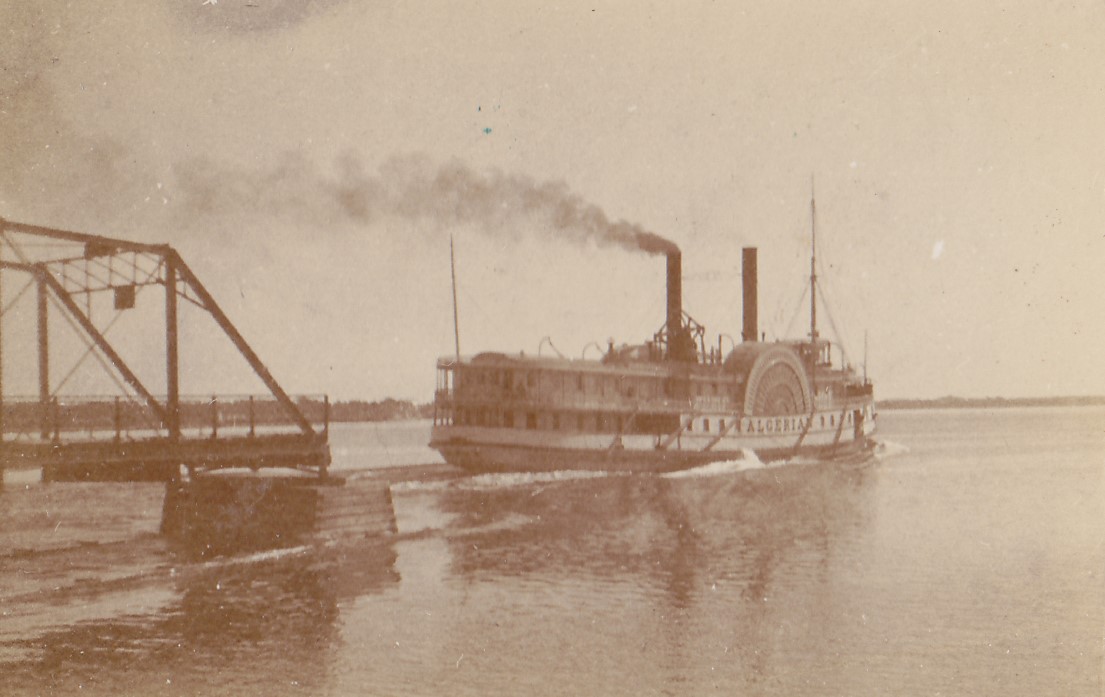 Ship passing through the swing section of the Bay Bridge on the Bay of Quinte.