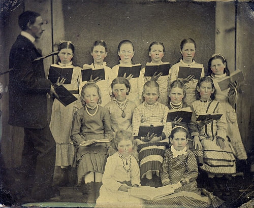 Choir of girls with their conductor.