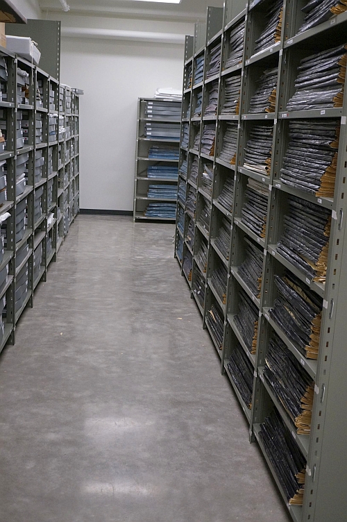 Newspapers neatly shelved.