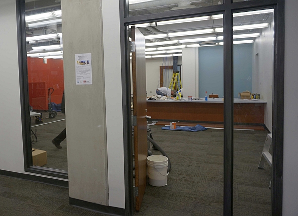 View through a doorway into a space under construction.