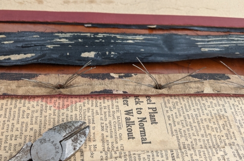 Wires in newspaper cut through with cutters.