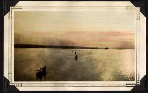 Canoes on the Bay of Quinte at sunrise.