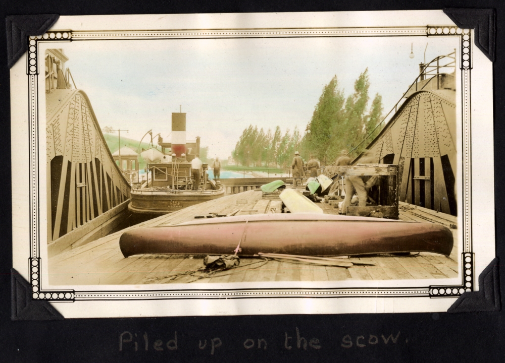 Canoes piled on a tug boat in the lift lock.