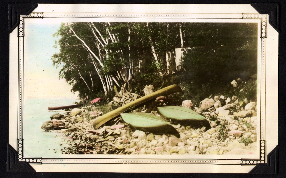 Canoes on the shore of a lake.