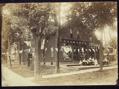 Photograph of people outside Pasmore's Pharmacy in Deseronto.