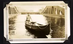 Man in canoe in lift lock cradle.