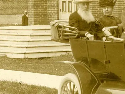 Lurking figure in background of photograph.