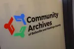 Front window of Community Archives of Belleville and Hastings County, with logo.