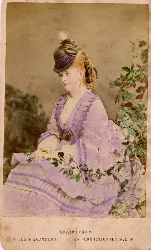 Hand-tinted photograph of a woman.