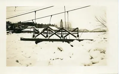 Footbridge damaged by ice on the river.