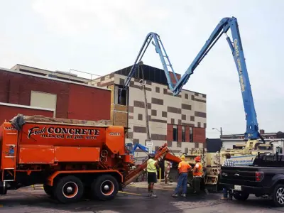 Concrete being pumped into Belleville Public Library building.