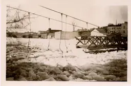 Footbridge damaged by ice on the river.